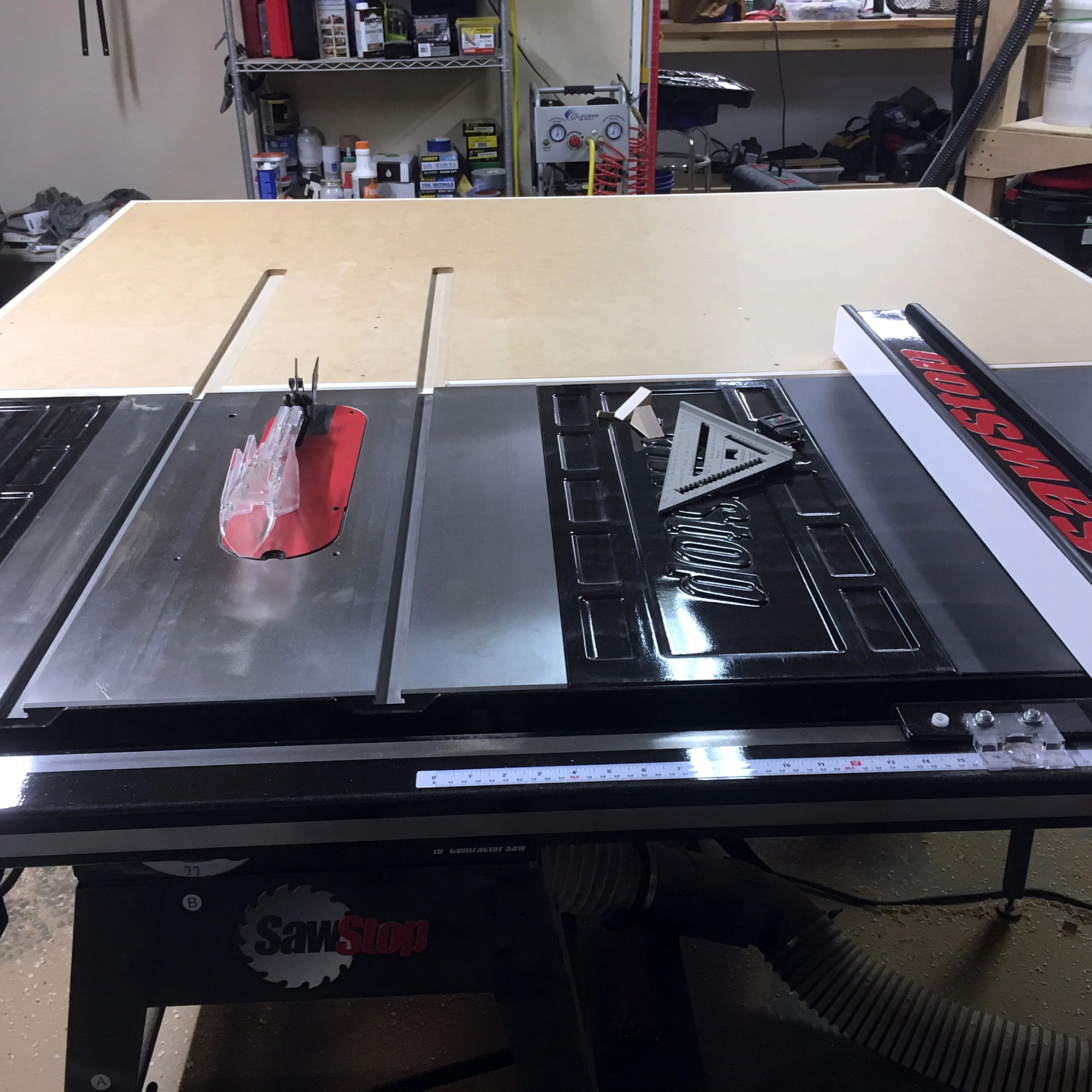 Assembly outfeed table attached to a table saw for outfeed support