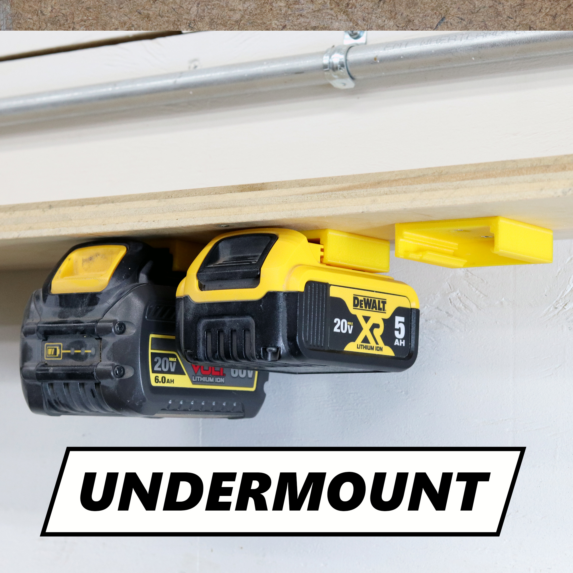 3D printed DeWalt battery holder mounted underneath a shelf