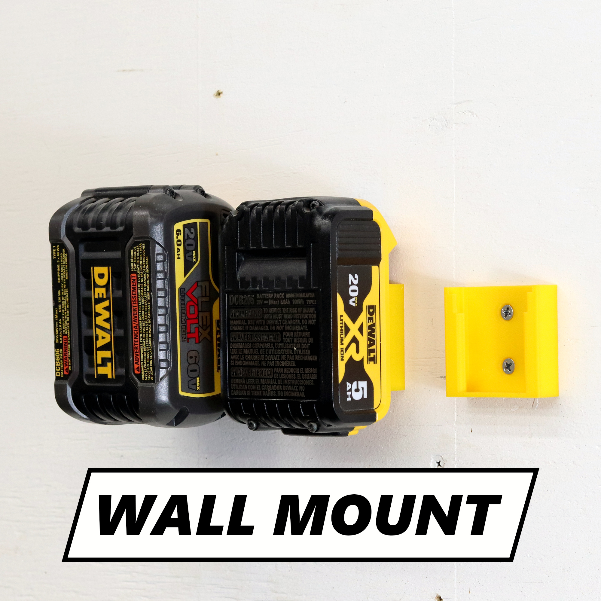 3D printed DeWalt battery holder mounted on a wall