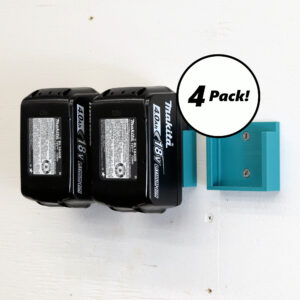 Four Makita battery holders mounted on a wall, each holding a 18V battery