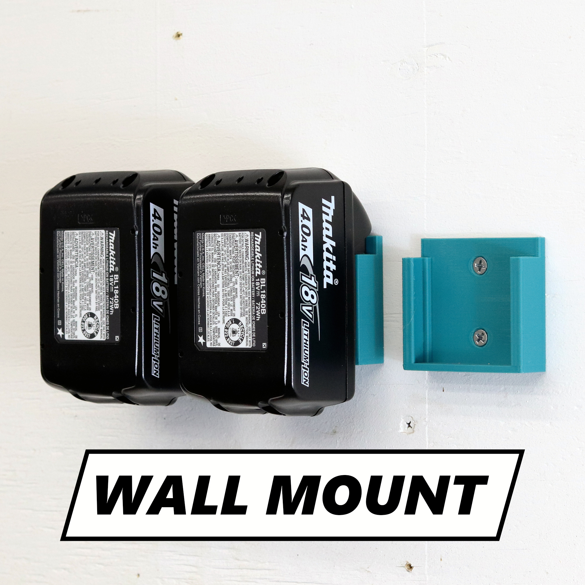 Makita battery holder mounted on a shop wall holding a 18V battery