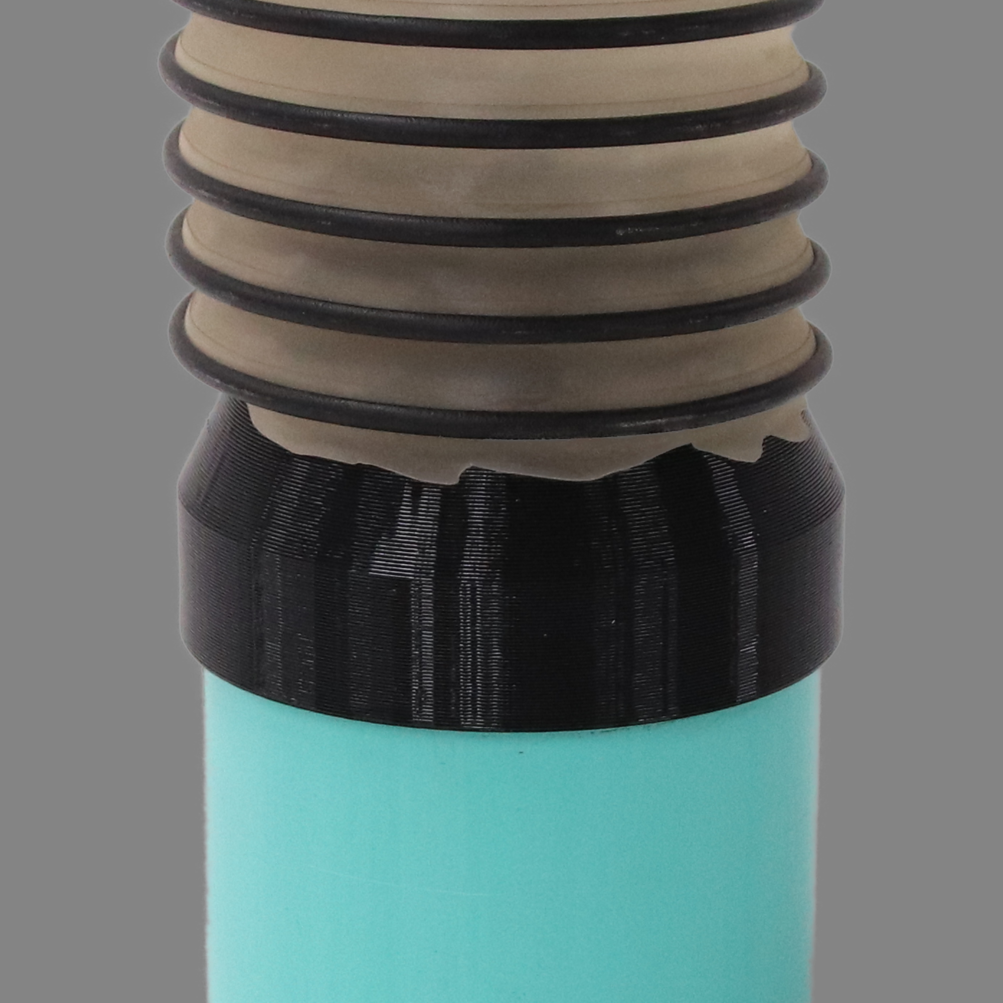Black PETG dust collection adapter connecting 4 inch SDR35 PVC to 4 inch flex hose, shown installed in a shop dust collection hose line