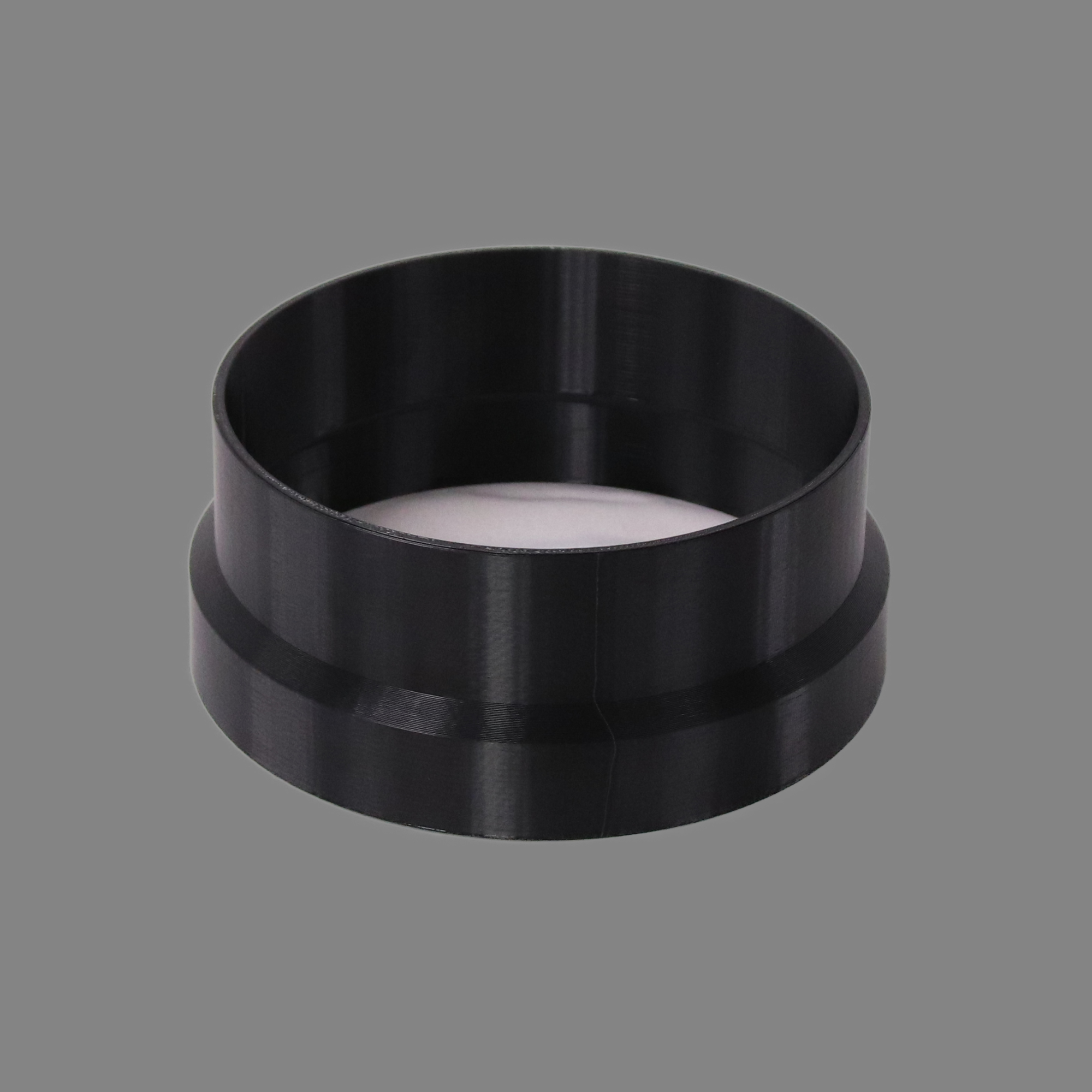 Black 3D printed PETG dust collection adapter connecting 6 inch SDR35 PVC to 6 inch flex hose, alternate angle product photo