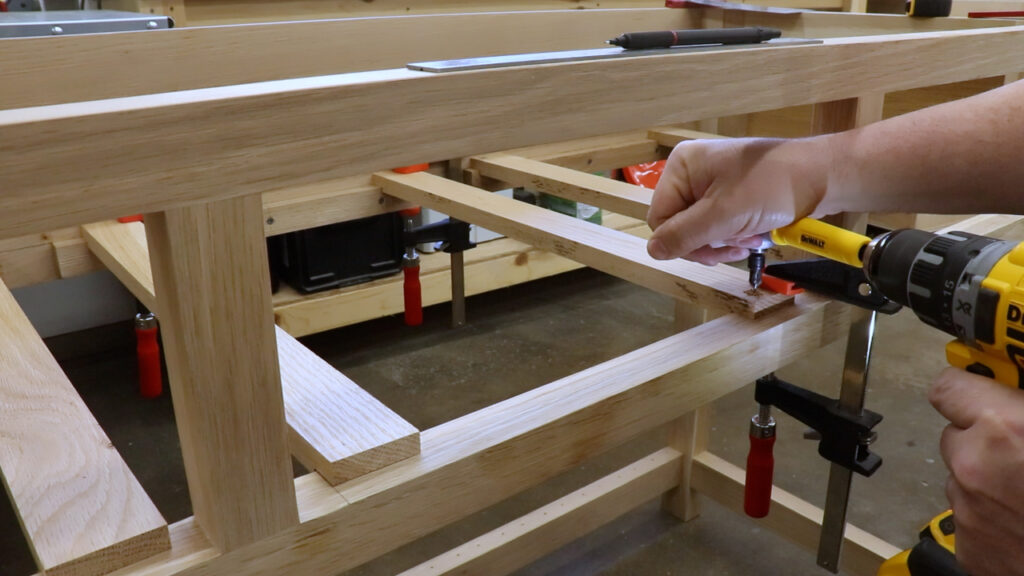 Drilling the drawer slides in a tight space with a right angle drill attachment