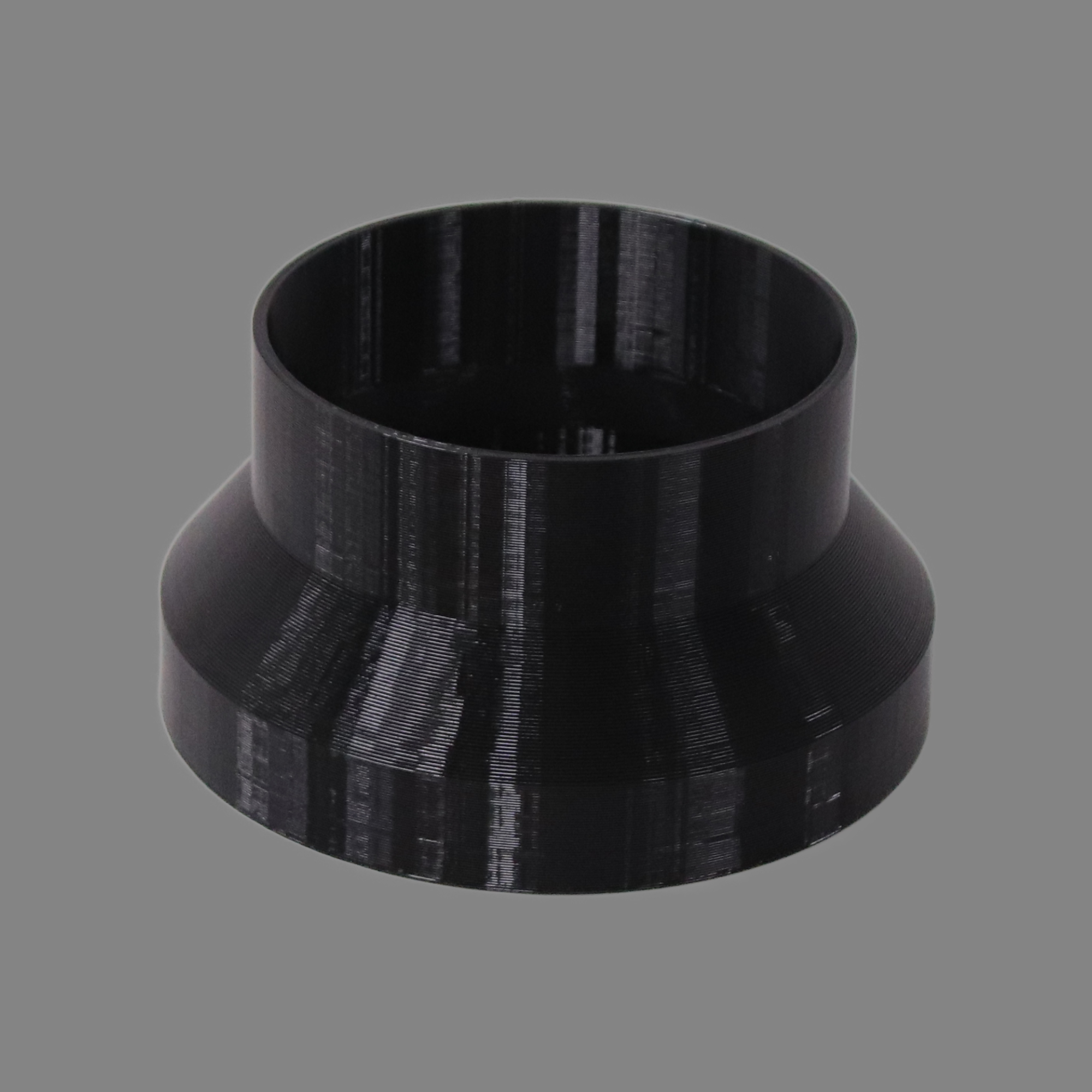 Black 3D printed PETG dust collection adapter connecting 6 inch SDR35 PVC to 5 inch flex hose, alternate angle product photo