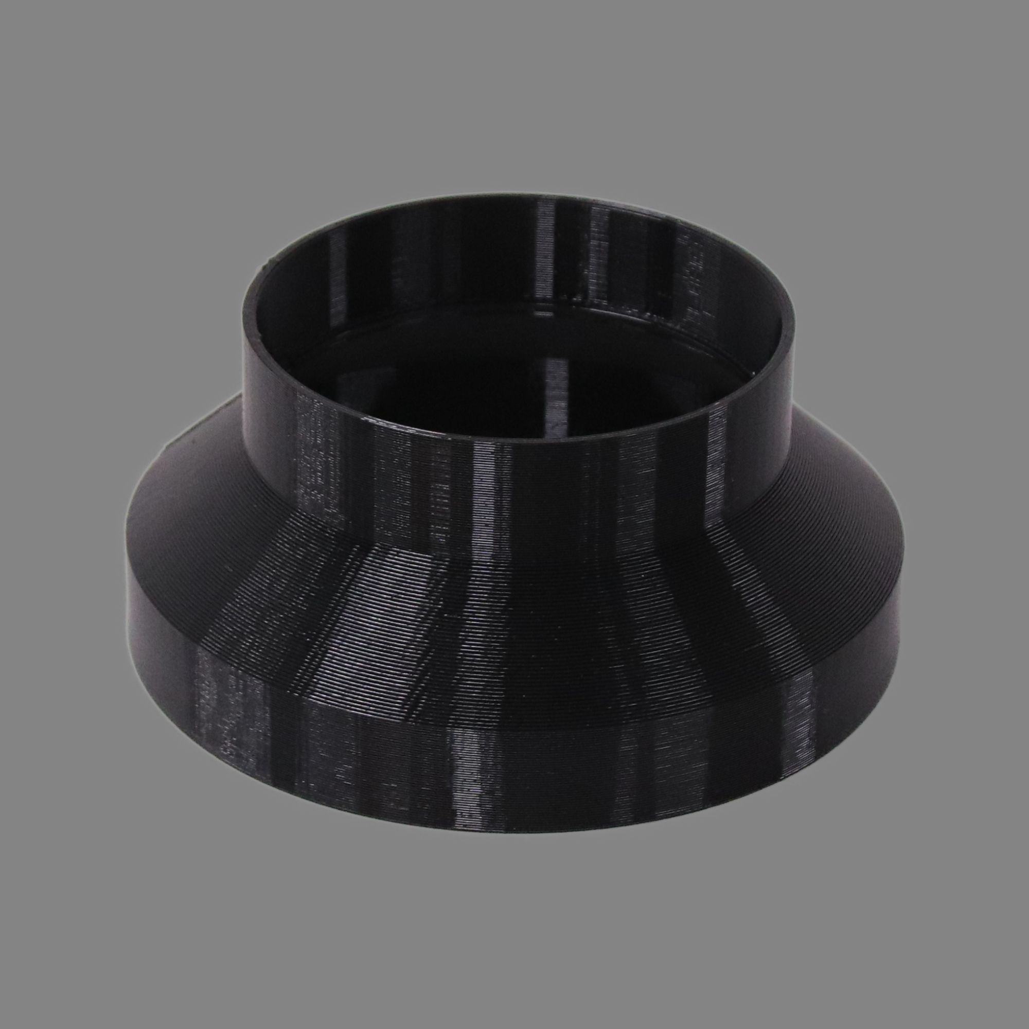 Black 3D printed PETG dust collection adapter connecting 6 inch SCH40 PVC to 4 inch SCH40 PVC, alternate angle product photo