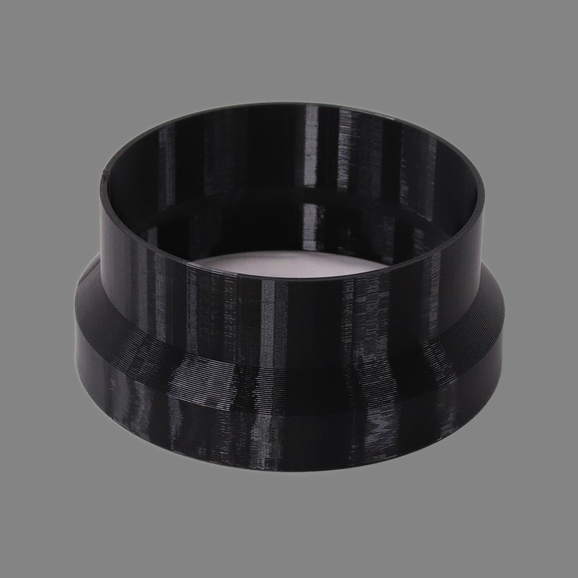 Black 3D printed PETG dust collection adapter connecting 6 inch SCH40 PVC to 6 inch flex hose, alternate angle product photo