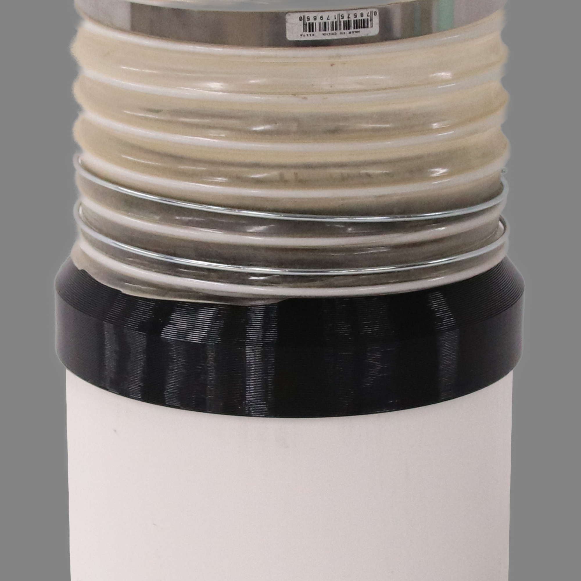 Black PETG dust collection adapter connecting 6 inch SCH40 PVC to 6 inch flex hose, shown installed in a shop dust collection hose line